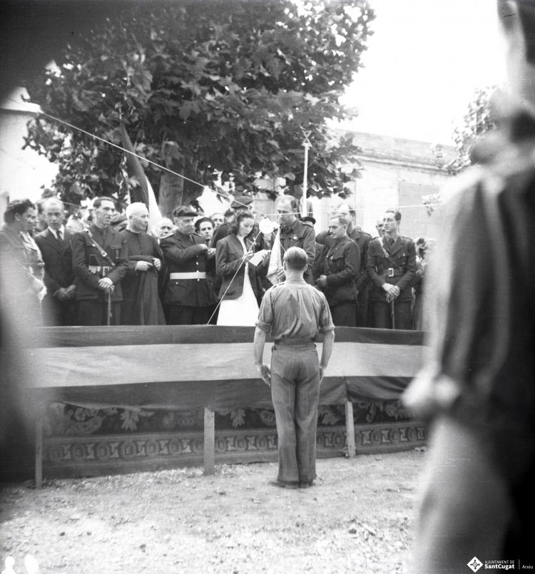 Fira de setembre. Desfilada i actes politicomilitars, a l'actual Parc de l'Hort de l'Abat-Jardins del Paga-li Joan.