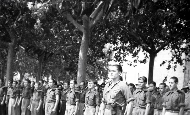 Fira de setembre. Desfilada i actes politicomilitars, a l'actual Parc de l'Hort de l'Abat-Jardins del Paga-li Joan.
