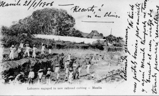 Laborers engaged in new railroad cutting - Manila