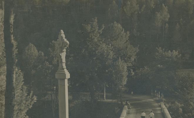 Creu de terme i pont de la riera de Rafamans a l'entrada de la Palma de Cervelló