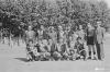 Retrat de grup, jugadors de l'equip de futbol acompanyats d'altres homes,  i d'un membre de la Guàrdia civil. Entre ells Pere Pahisa i Manel Farrés.